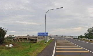 Completed concrete bridge over river